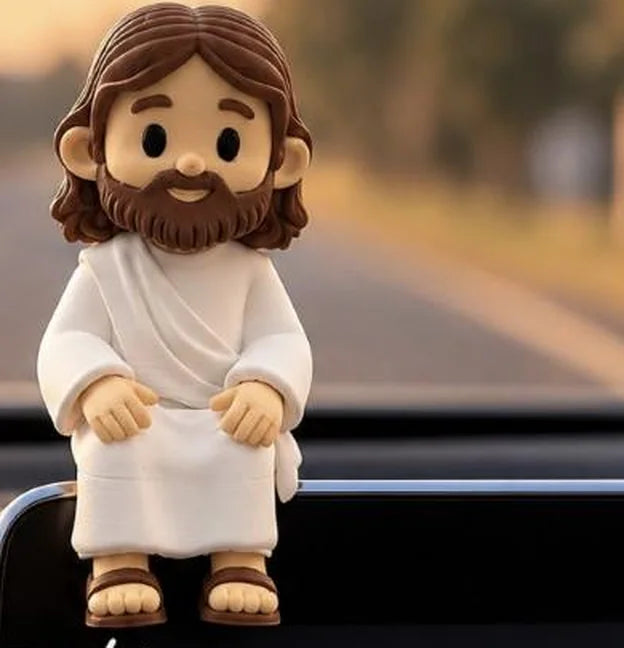 Mini Jesus impresso em 3D sentado no painel do carro